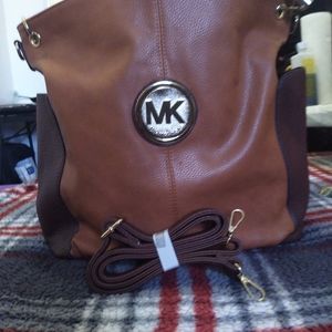 Selling a knock off Micheal Kors bag